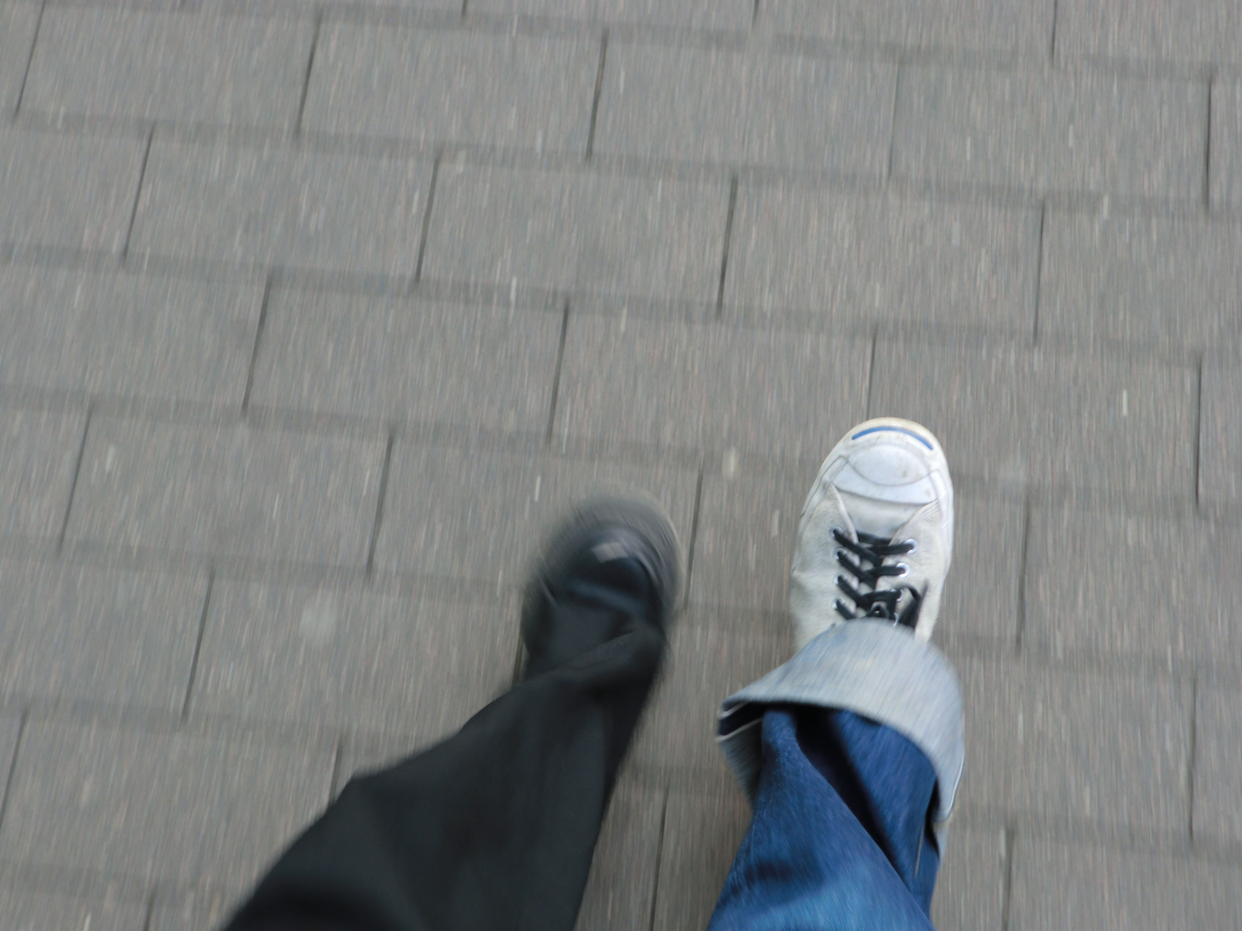 two legs by two people seen while walking 1