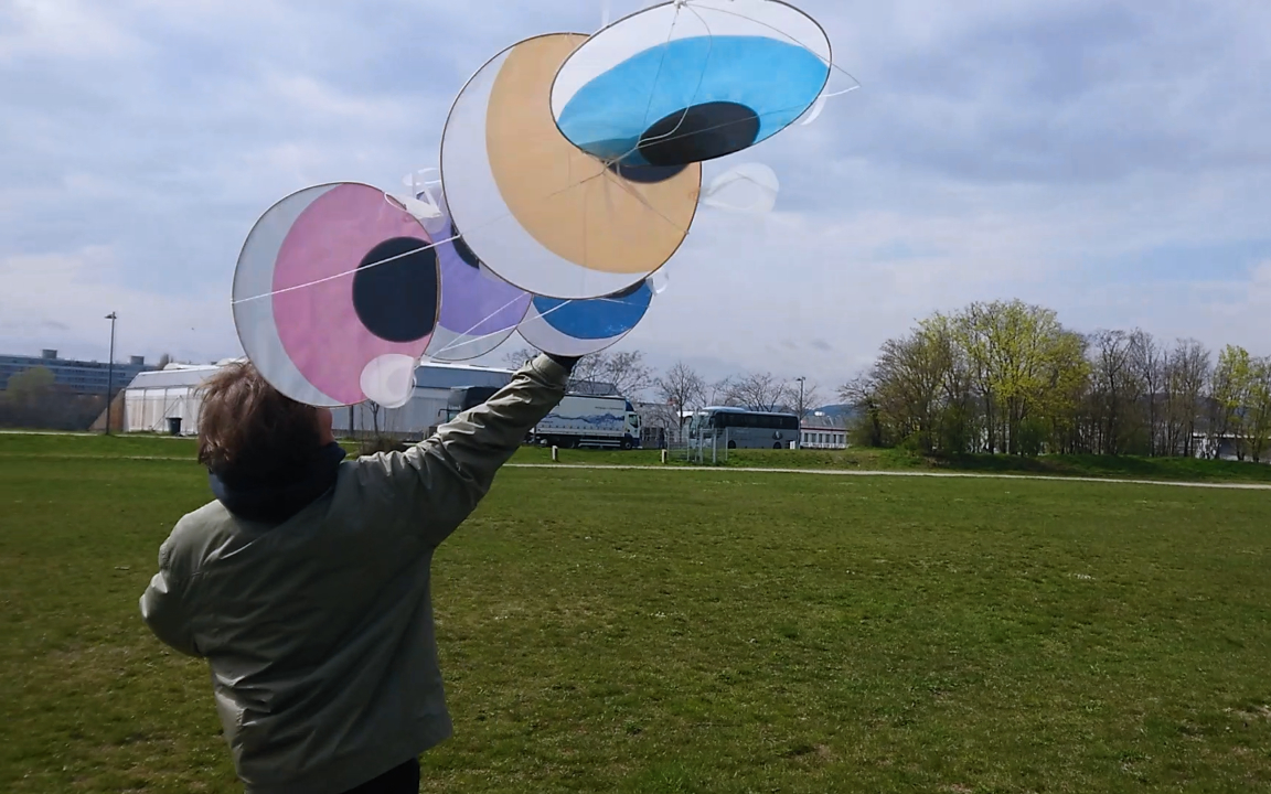 leon holding the tangled kite in the wind